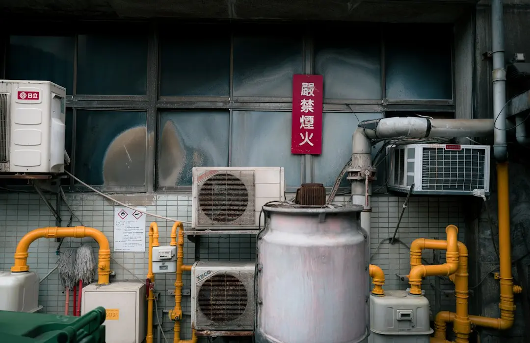 Outdoor AC condenser nameplate showing refrigerant type and model number Outdoor AC condenser nameplate showing refrigerant type and model number