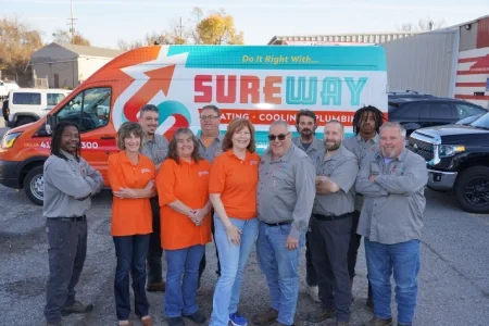 Team members standing in front of Sureway Comfort branded van